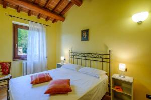 a bedroom with a bed with two pillows on it at Villa Emilianna 12&2 by Marche Holiday Villas in Fano +41 photos