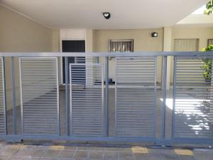 a metal fence in front of a building at Shanti Loft in San Juan