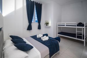 Katil atau katil-katil dalam bilik di LEMON SUITES APARTMENTS