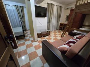 TV a/nebo společenská místnost v ubytování Boutique Hotel Colosseo