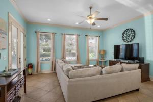 a living room with a couch and a flat screen tv at Home Sweet Destin - 6BDR - Sleeps 14 - Next 2 Beach in Destin