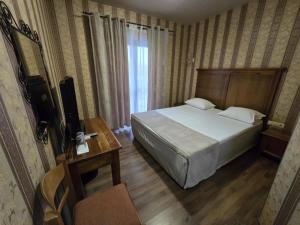 Postel nebo postele na pokoji v ubytování Boutique Hotel Colosseo