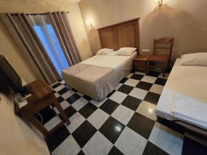Postel nebo postele na pokoji v ubytování Boutique Hotel Colosseo
