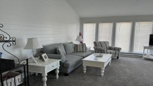 a living room with a couch and two chairs at Pavloski in Beach Haven