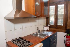 A kitchen or kitchenette at Medieval Hamlet Malpertus