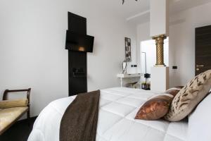 Postel nebo postele na pokoji v ubytování Aparthotel Dei Mercanti