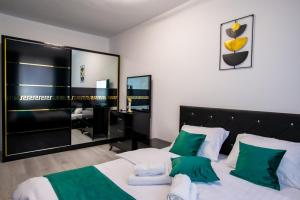 Postel nebo postele na pokoji v ubytování Joy Residence
