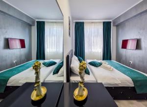 Postel nebo postele na pokoji v ubytování Joy Residence