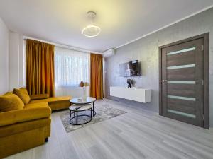 TV a/nebo společenská místnost v ubytování Joy Residence