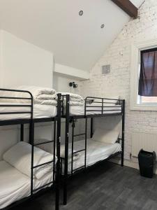 Postel nebo postele na pokoji v ubytování Rahman Hostel