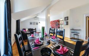 a dining room with a table with pink napkins on it at Apartment Luka in Dubrovnik +27 photos