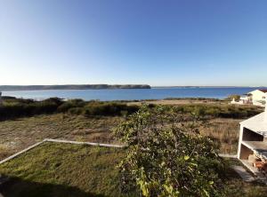 a view of the water from a house at Apartments Lana in Zadar