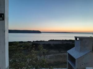 a view of the ocean at sunset from a house at Apartments Lana in Zadar +23 photos