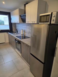 Kuchyň nebo kuchyňský kout v ubytování LUANJO Apartments - Celle