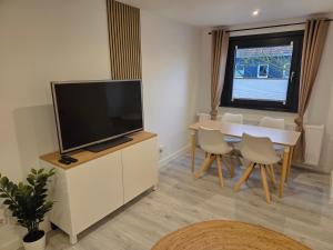 TV a/nebo společenská místnost v ubytování LUANJO Apartments - Celle