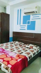 a large bed in a room with avertisement at Hotel Love Bite in Hisār