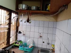 a kitchen with a sink and a counter top at Fadilimmo07 in Yaoundé