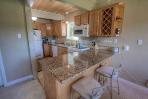 a kitchen with wooden cabinets and a counter top at Park View Paradise condo in Tahoe City