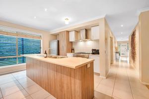 a kitchen with a sink and a counter top at Ocean Grove retreat in Ocean Grove