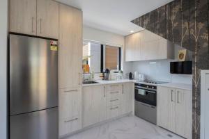 Η κουζίνα ή μικρή κουζίνα στο Cosy Retreat at Biddle Crescent