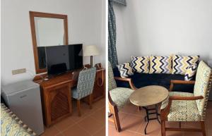 a living room with a couch and a table and a tv at N&F DOMINA CORAL BAY in Sharm El Sheikh