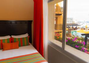 Postel nebo postele na pokoji v ubytování Hotel Tesoro Los Cabos