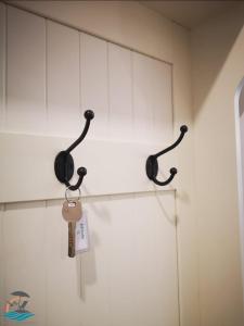 two black phones hanging on a wall at Jad Studio Mamaia Nord in Mamaia Nord