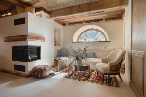 a living room with a couch and a fireplace at Villa Vena in Zakopane
