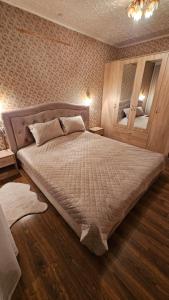 a bedroom with a large bed in a room at Celtnieku 14 in Ventspils