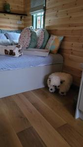 a room with a bed and two stuffed animals on the floor at Cater Tober Haven in Wick +32 photos
