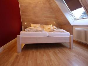 En eller flere senge i et værelse på Ferienwohnung in Westerland auf Sylt