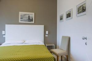 Postel nebo postele na pokoji v ubytování Hotel Mirella