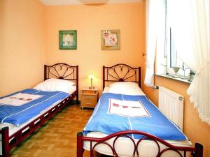 Postel nebo postele na pokoji v ubytování Bungalow Klönsnack, Dornumersiel