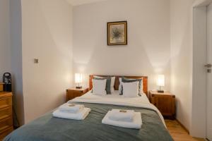Posteľ alebo postele v izbe v ubytovaní Time Apartment + 17 fotografií
