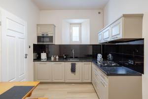 Kuchyňa alebo kuchynka v ubytovaní Time Apartment