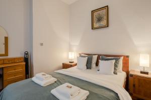 Posteľ alebo postele v izbe v ubytovaní Time Apartment