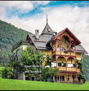 a large house with a turret on top of a hill at Villa Franz Xaver in St. Wolfgang +58 photos