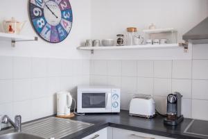Kuchyňa alebo kuchynka v ubytovaní City center duplex loft + 20 fotografií