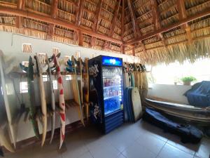 a vending machine in a room with skis on the wall at Rancho de Pedro in El Viejo
