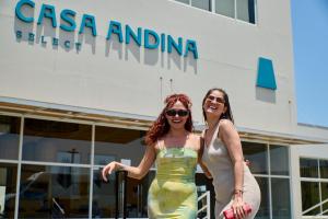 two women are standing in front of a building at Casa Andina Select Paracas in Paracas