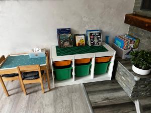 a toy kitchen with a table and a table and a table and a tableablish at Holiday House Papuk in Novo Zvecevo +32 photos