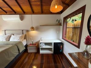 Cama ou camas em um quarto em I'Lumiar Loft