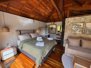 Cama ou camas em um quarto em I'Lumiar Loft