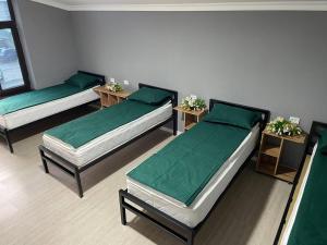 Voodi või voodid majutusasutuse Zam Zam Hostel toas