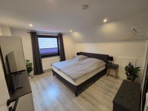 Postel nebo postele na pokoji v ubytování LUANJO Apartments - Celle