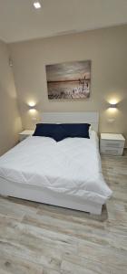 Katil atau katil-katil dalam bilik di Reef Apartment