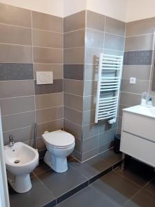 a bathroom with a toilet and a sink at Luxury Apartment MonacoView in Beausoleil +20 photos