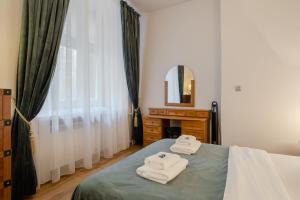 Posteľ alebo postele v izbe v ubytovaní Time Apartment