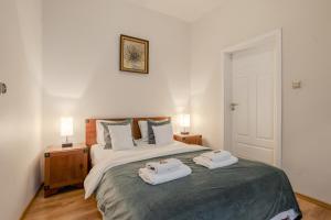 Posteľ alebo postele v izbe v ubytovaní Time Apartment