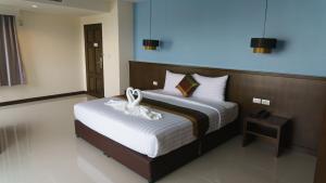 Postel nebo postele na pokoji v ubytování VISA Hotel Hua Hin - SHA Plus + 33 fotografií